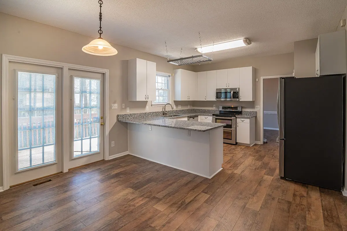Spacious luxury vinyl plank flooring in a kitchen